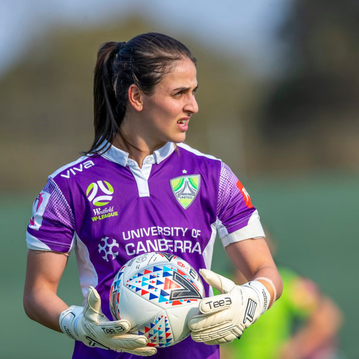 Canberra United goalkeeper with the ball in her hands with tTee3 Goalkeeper gloves during a match