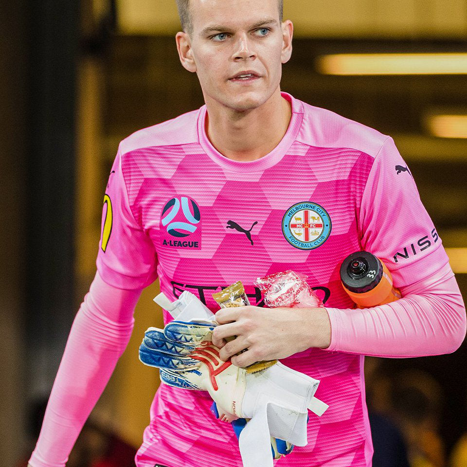 Melbourne City goalkeeper with Tee3 Goalkeeping gloves stepping on to the field to play