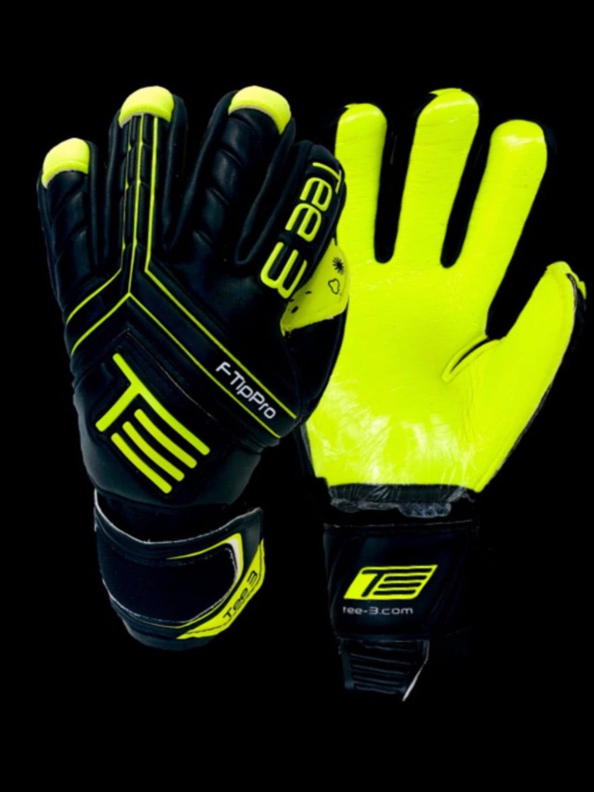 A black and fluro yellow goalkeeping glove with removable finger spines saves with 4mm contact grip worn by professional goalkeepers